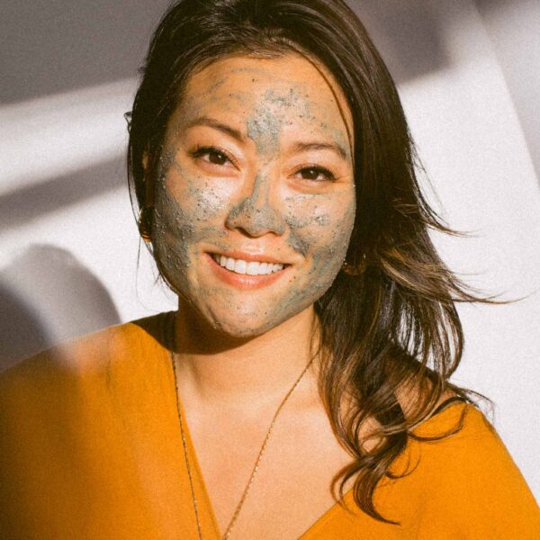 woman with clay mask on her face