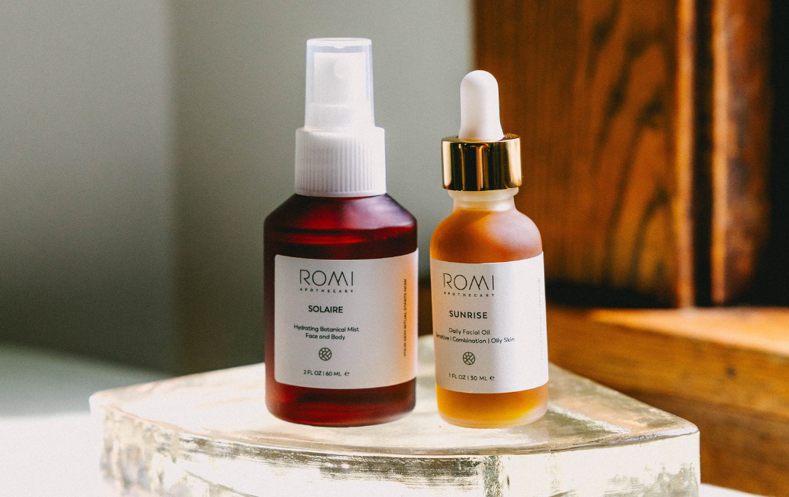 two parts of a morning skincare routine, bottles of our solaire and Sunrise oil in the sunshine